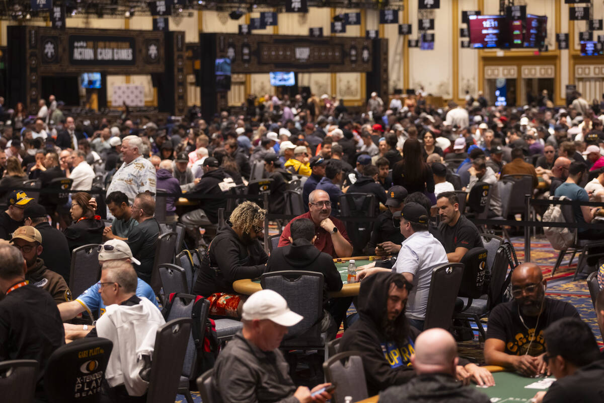 Attendees compete in the $500 industry employees no-limit hold'em event during the first day of ...