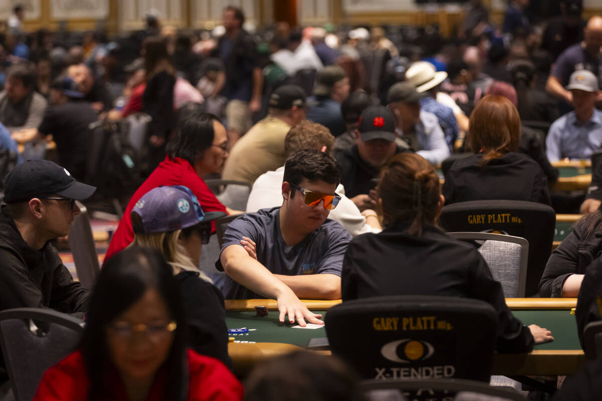 Attendees compete in the $500 industry employees no-limit hold'em event during the first day of ...