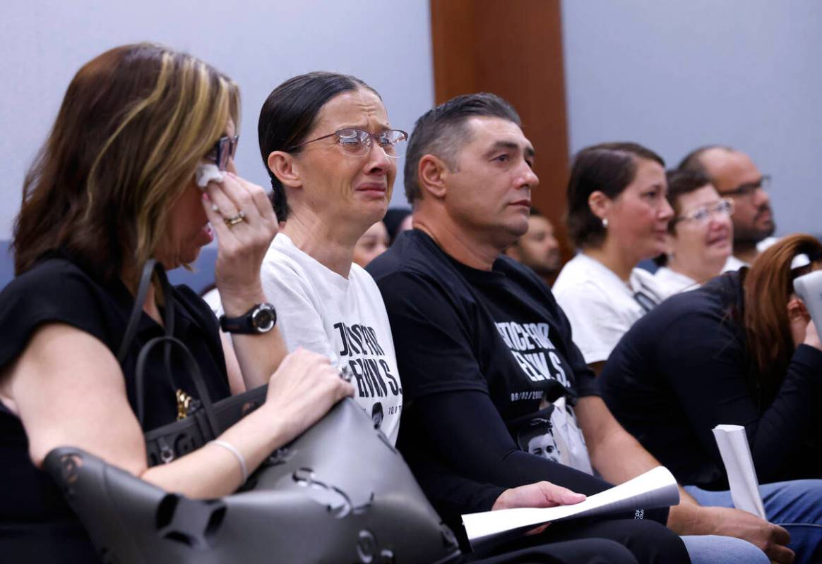 Velida Husic, second left, Alen Sejdinovic, center, parents of a shooting victim, Elvin Sejdino ...