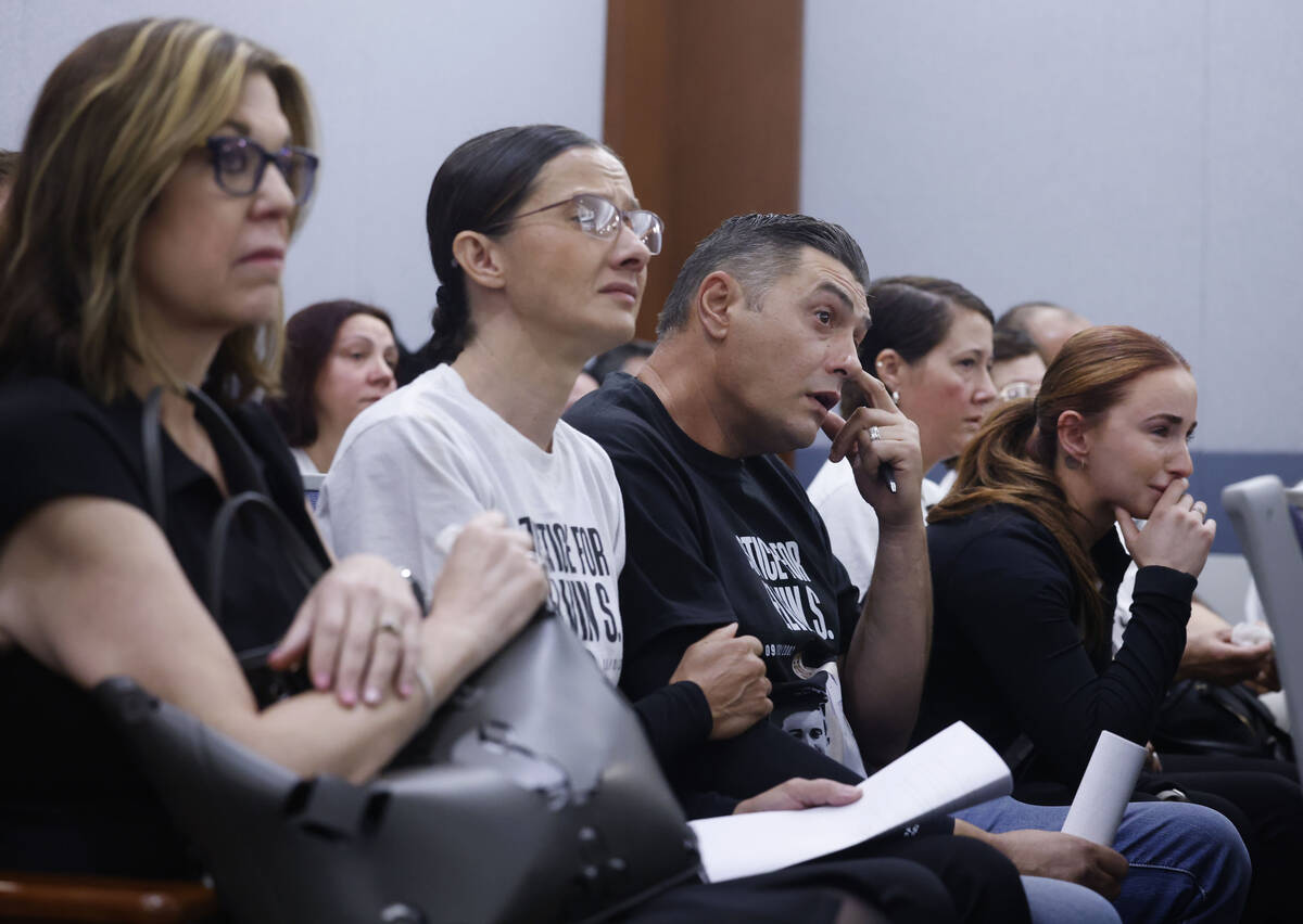 Velida Husic, second left, Alen Sejdinovic, center, parents of a shooting victim, Elvin Sejdino ...