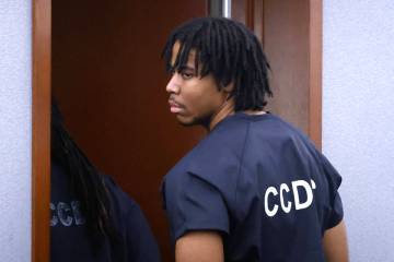 Keyun Watts, who pleaded guilty to a fatal road rage case, is led out of a courtroom after his ...