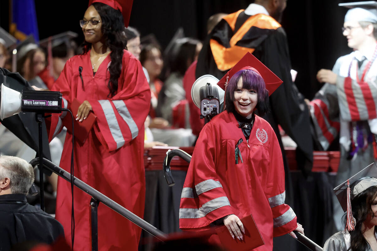 An Arbor View High School student wears a ribbon honoring classmate McKenzie Scott during grad ...