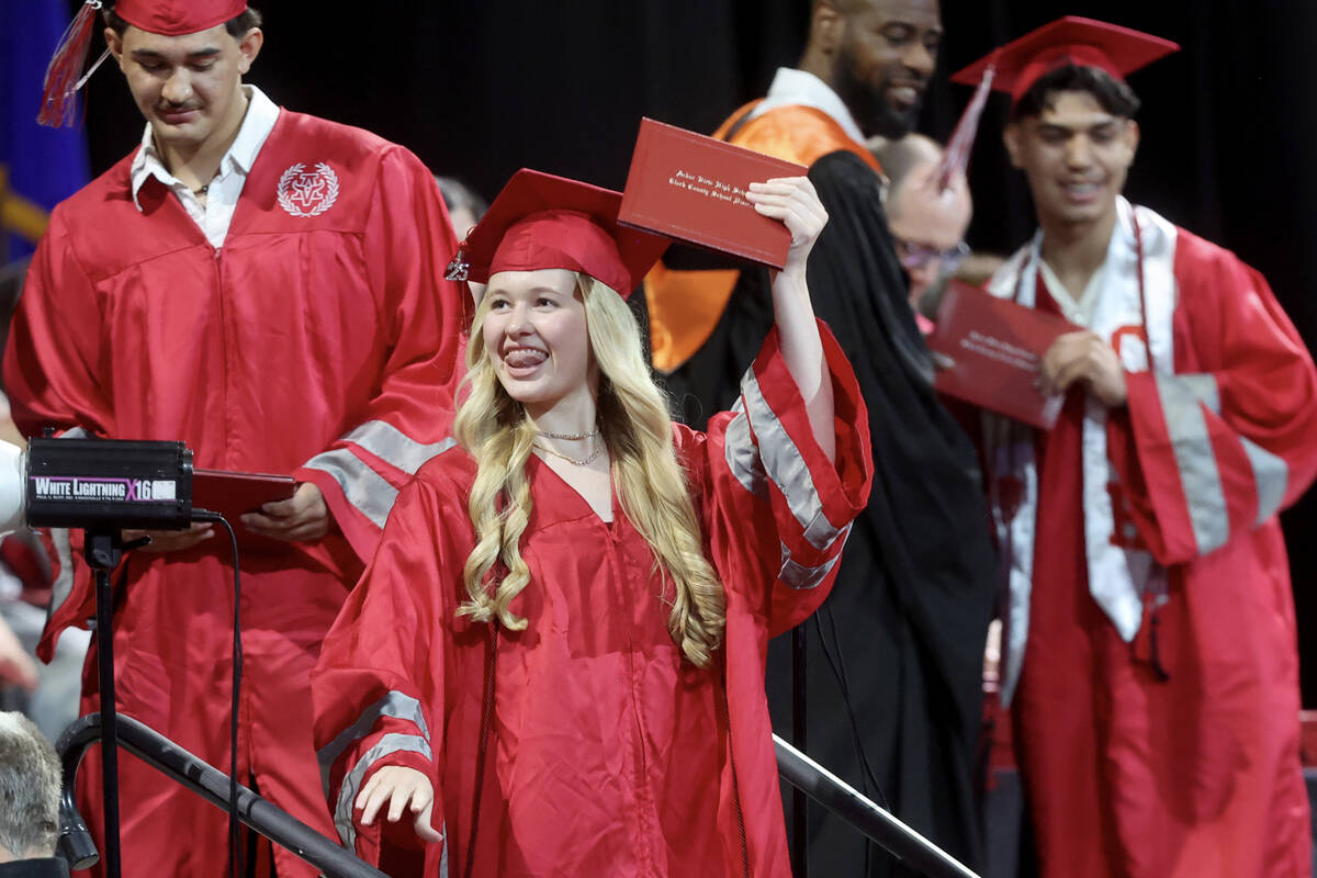 Arbor View High School students receive their diplomas during graduation at the Thomas & Ma ...