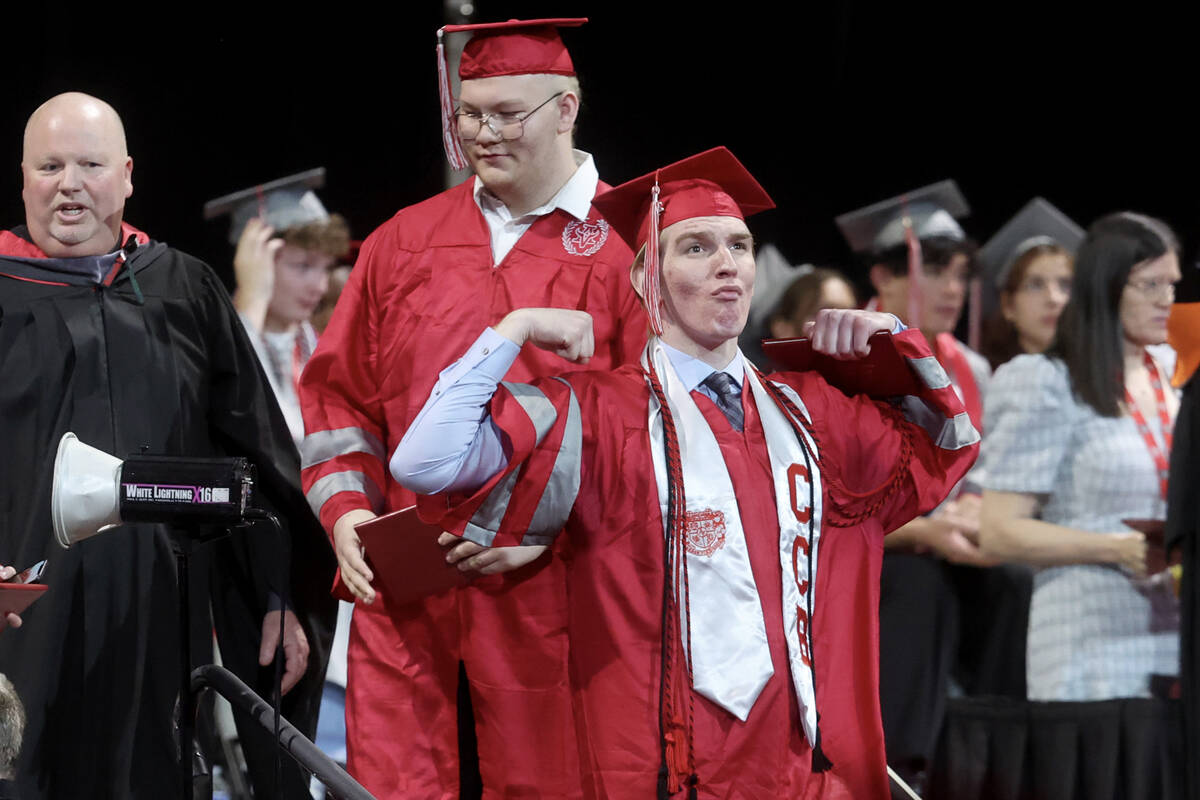 Arbor View High School students receive their diplomas during graduation at the Thomas & Ma ...