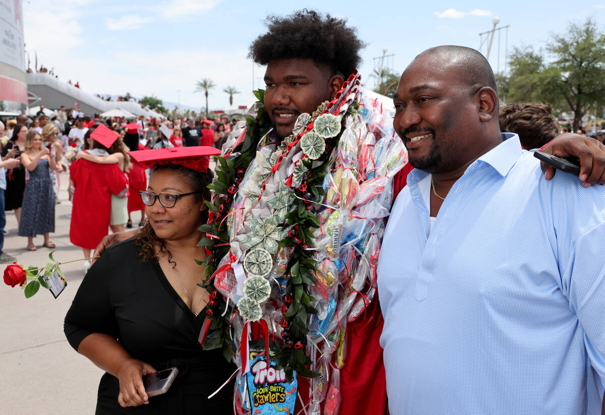 Arbor View High School graduate Daniel Boyd celebrate with his parents Michelle and Derrick Boy ...