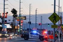 Metro police block off a short section of Charleston Boulevard as they investigate a homicide o ...