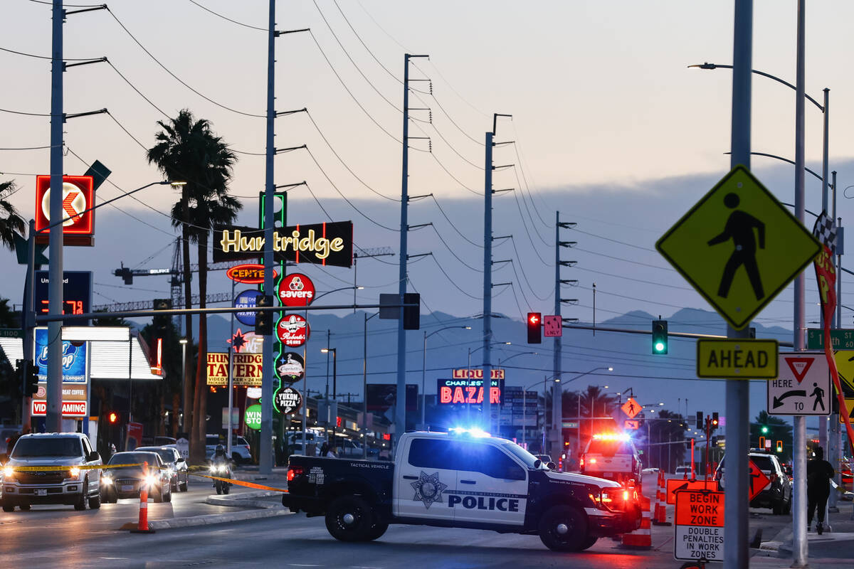 The Metropolitan Police Department blocks off a short section of Charleston Boulevard as they i ...