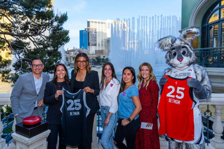 Participants gather as the fountains are fired off once more during the launching of BetMGM bec ...