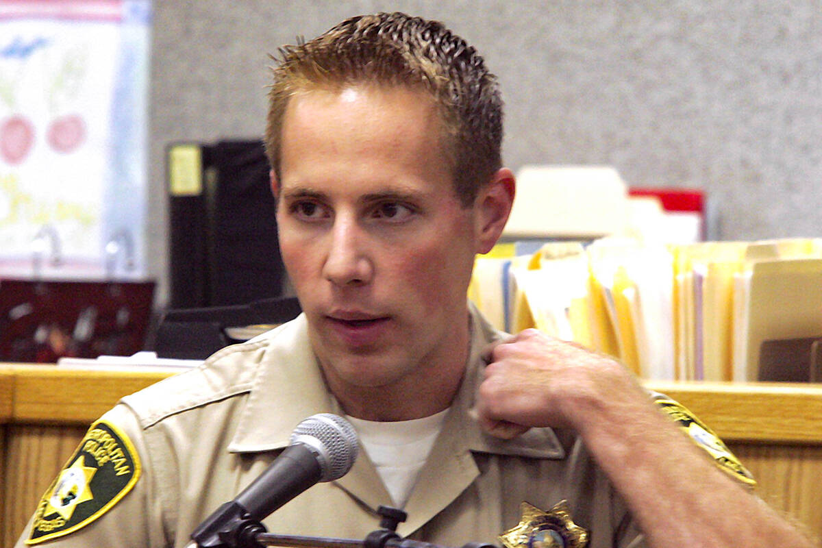 In this Review-Journal file photo from June 25, 2004, Metro officer Reggie Rader shows where he ...