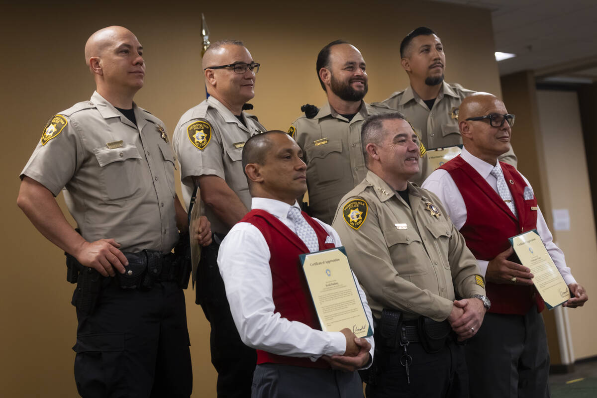 A group of officers, along with two civilians from Delta Airlines, who helped save a suicidal w ...