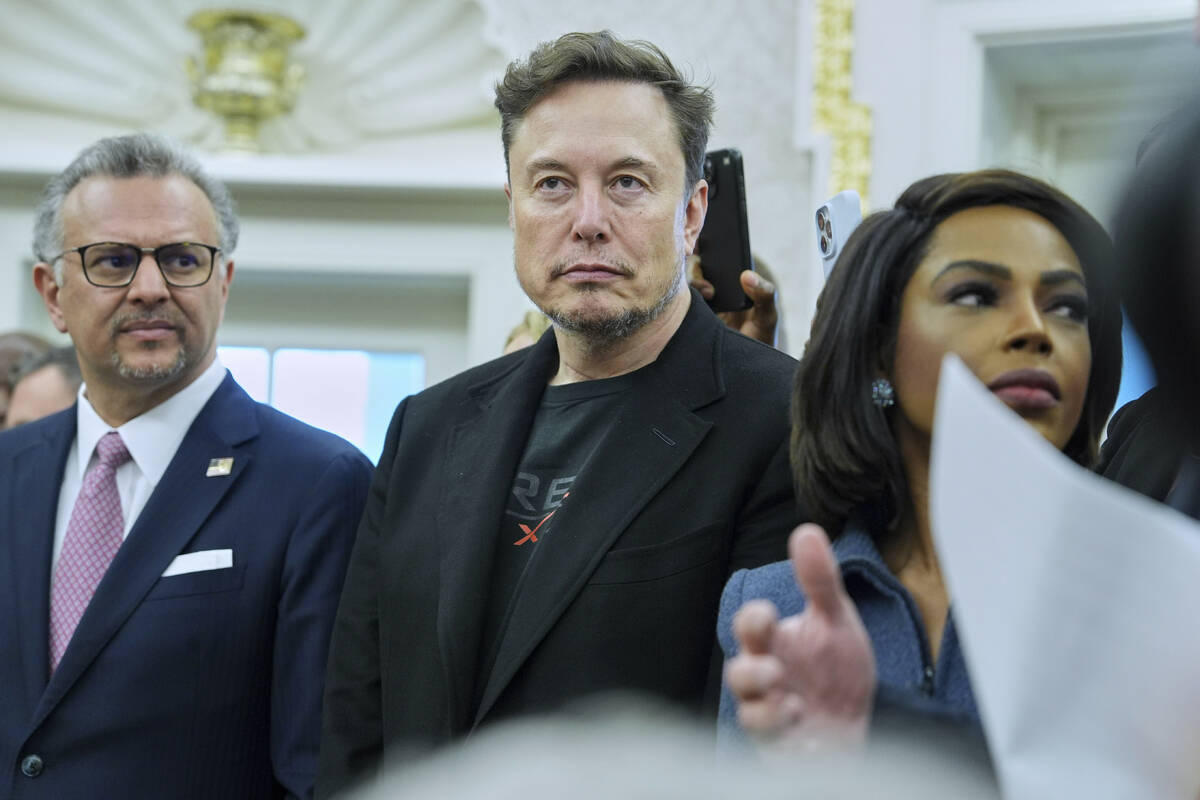 Elon Musk looks on as President Donald Trump meets South African President Cyril Ramaphosa in t ...