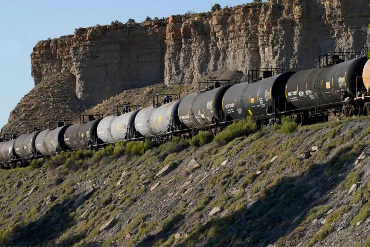 A train transports freight on a common carrier line near Price, Utah, July 13, 2023. (AP Photo/ ...