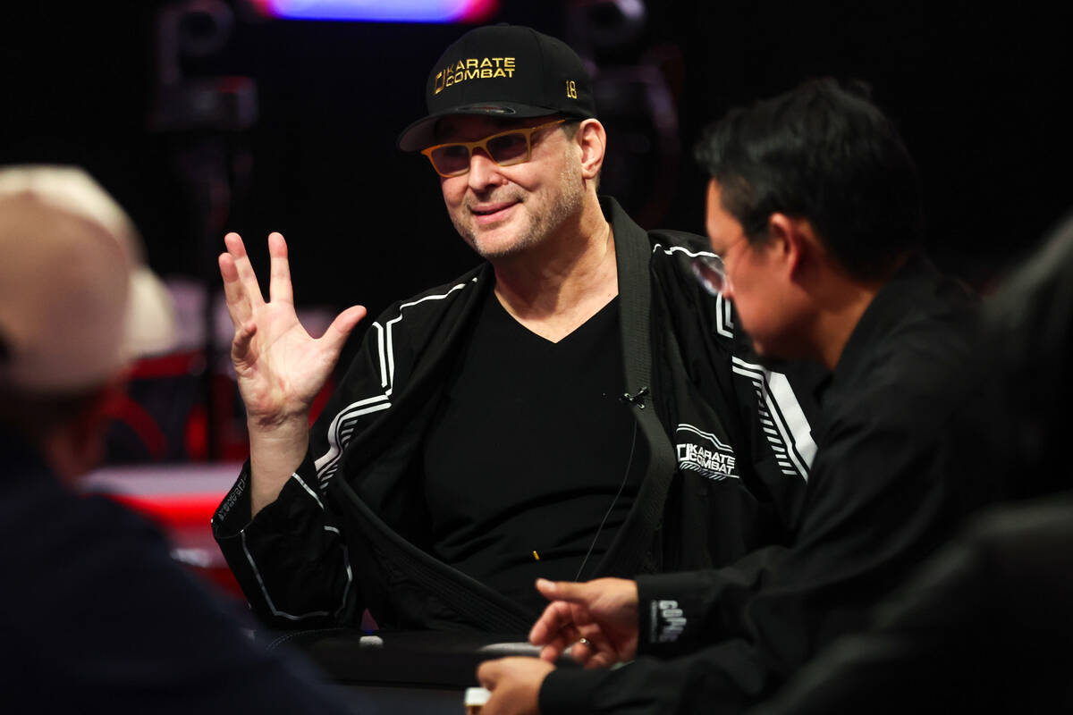 Phil Hellmuth converses at the table during the World Series of Poker main event at Horseshoe C ...