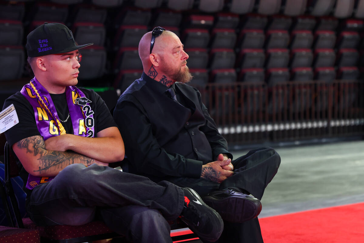 Thomas Enright and TJ Enright, father and brother of Keanu Enright, attend what would have been ...