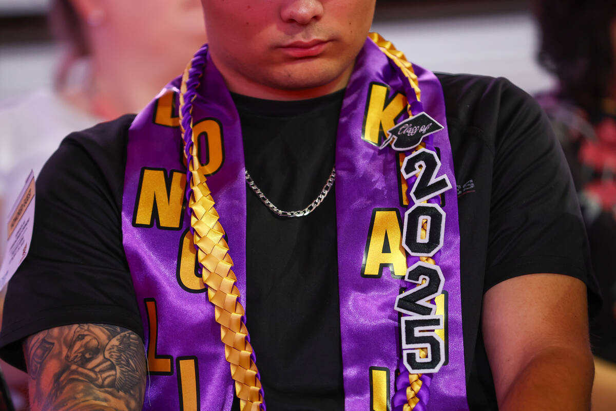 TJ Enright wears a stole and cords commemorating his brother Keanu Enright on Thursday, May 29, ...
