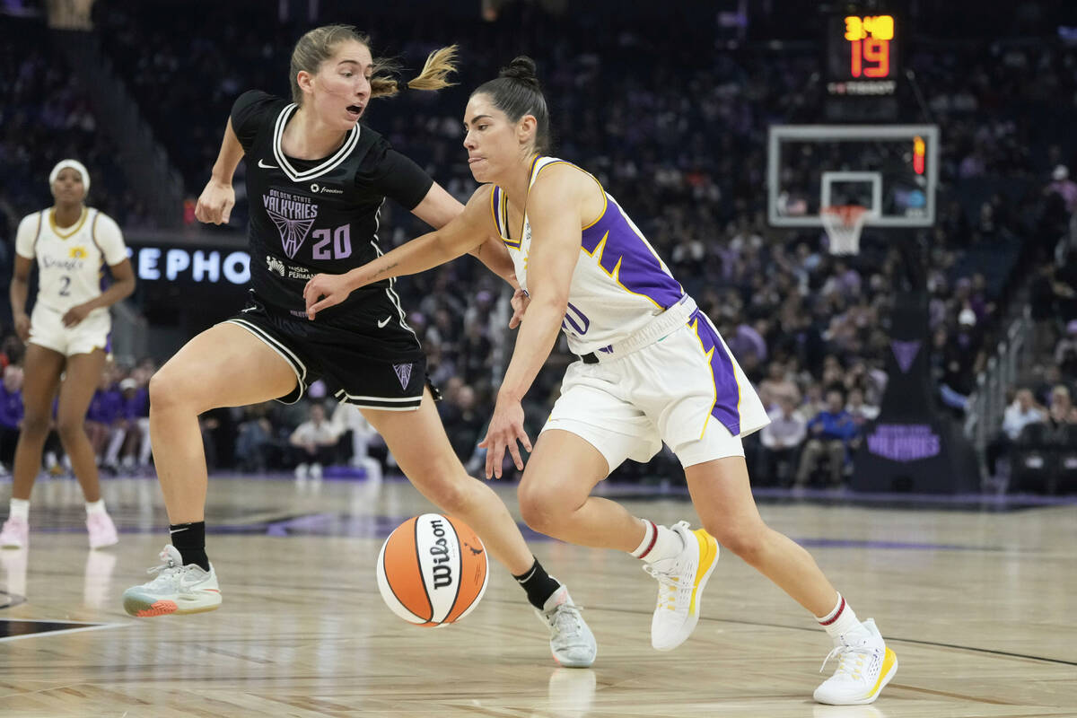 Los Angeles Sparks guard Kelsey Plum, right, drives to the basket against Golden State Valkyrie ...