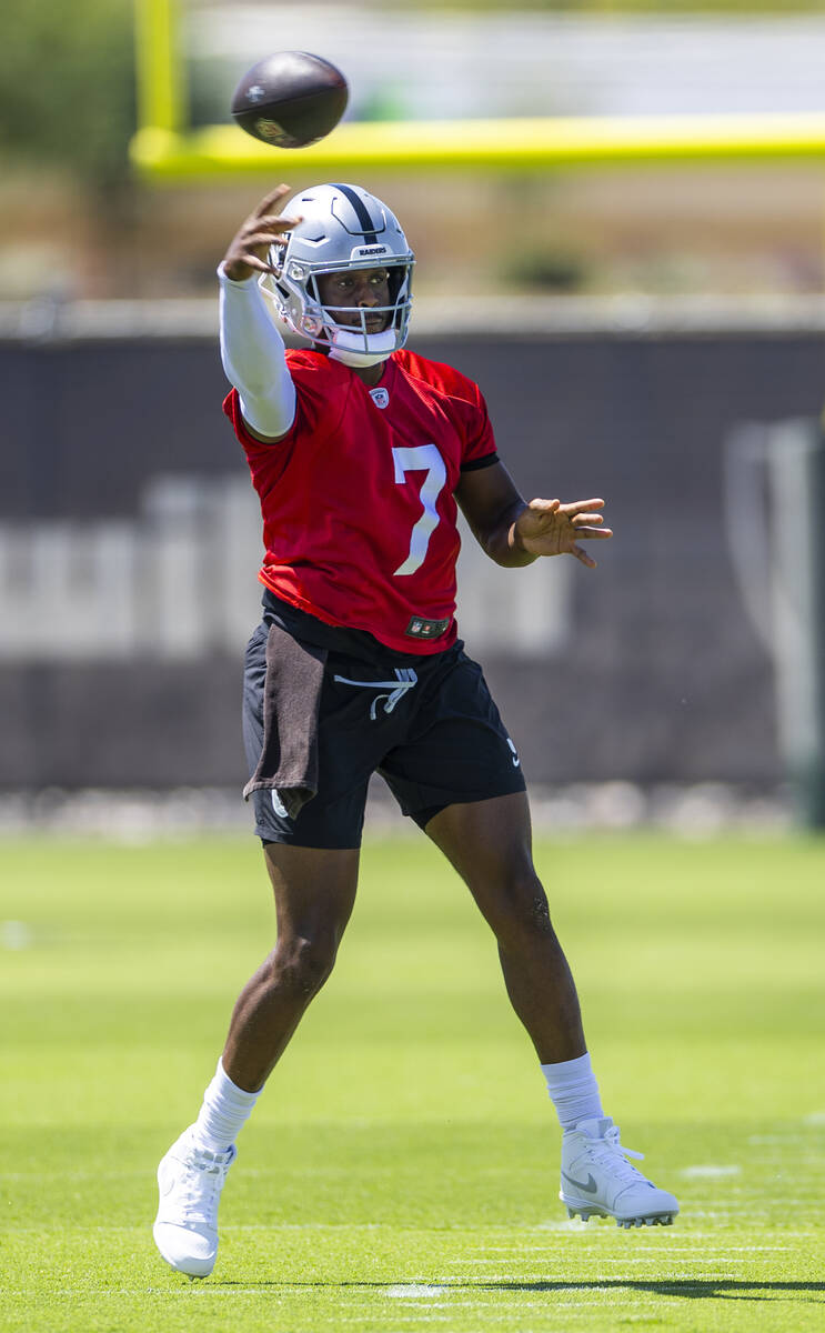Raiders quarterback Geno Smith (7) gets off a pass during OTA's at the Intermountain Health Per ...