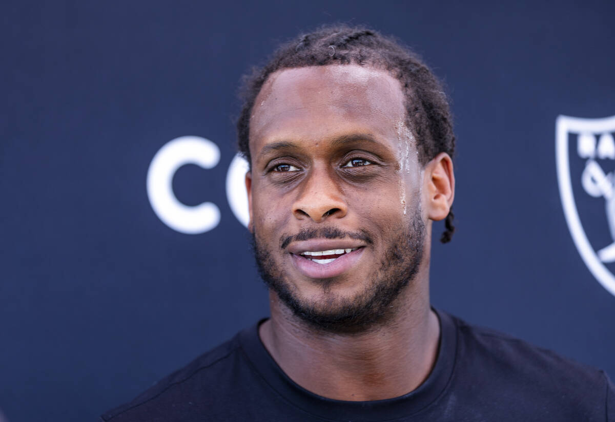 Raiders quarterback Geno Smith (7) speaks during OTA's at the Intermountain Health Performance ...
