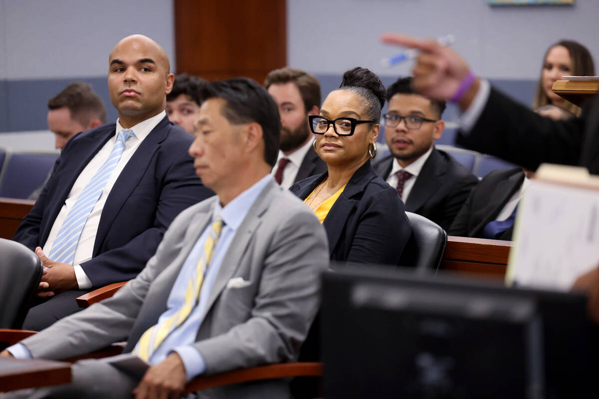 Justin Simpson and Arnelle Simpson, children of O.J. Simpson, listen during a court hearing reg ...