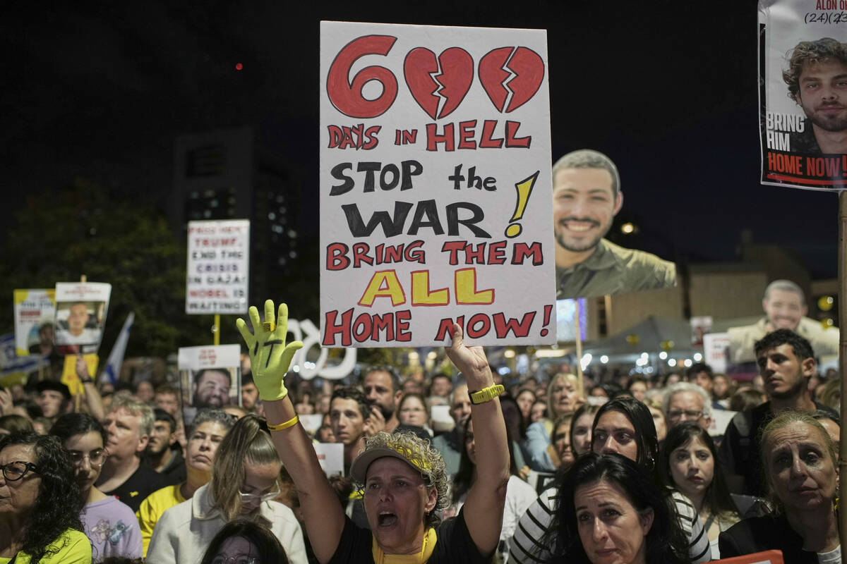 People attend a rally marking 600 days since Israelis were taken hostage by Hamas in Gaza, dema ...