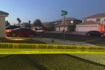 Police work at the scene of a homicide in the 3600 block of North Campbell Road in Las Vegas on ...