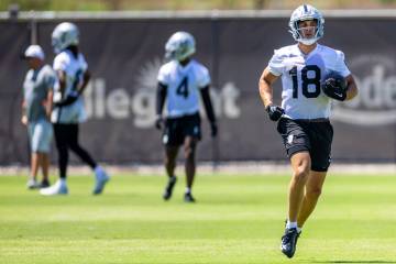 Raiders wide receiver Jack Bech (18) runs upfield after a catch during OTA's at the Intermounta ...
