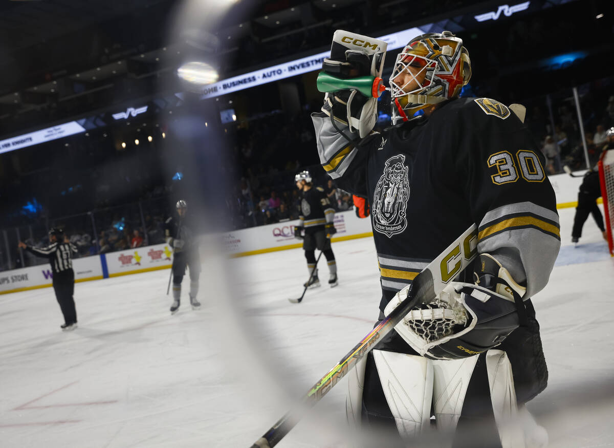 Silver Knights goaltender Carl Lindbom takes a sip of water during an AHL hockey game against t ...