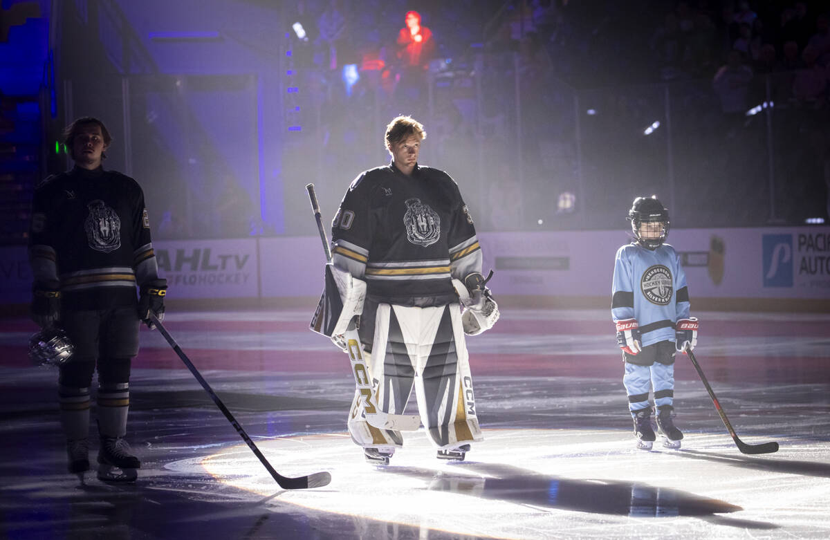 Silver Knights goaltender Carl Lindbom, center, is introduced before an AHL hockey game against ...