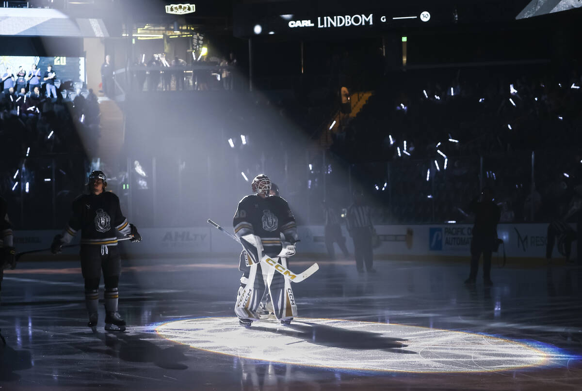 Silver Knights goaltender Carl Lindbom, center, is introduced before an AHL hockey game against ...