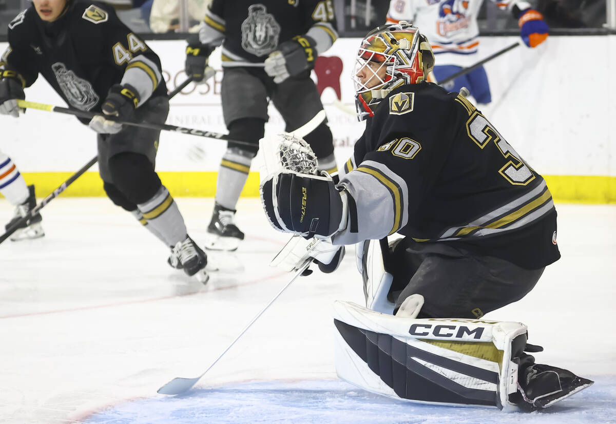 Silver Knights goaltender Carl Lindbom (30) defends the net during an AHL hockey game against t ...
