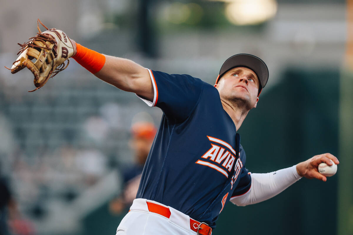 Aviators outfielder Seth Brown (4) throws a ball to the crowd during a baseball game between th ...