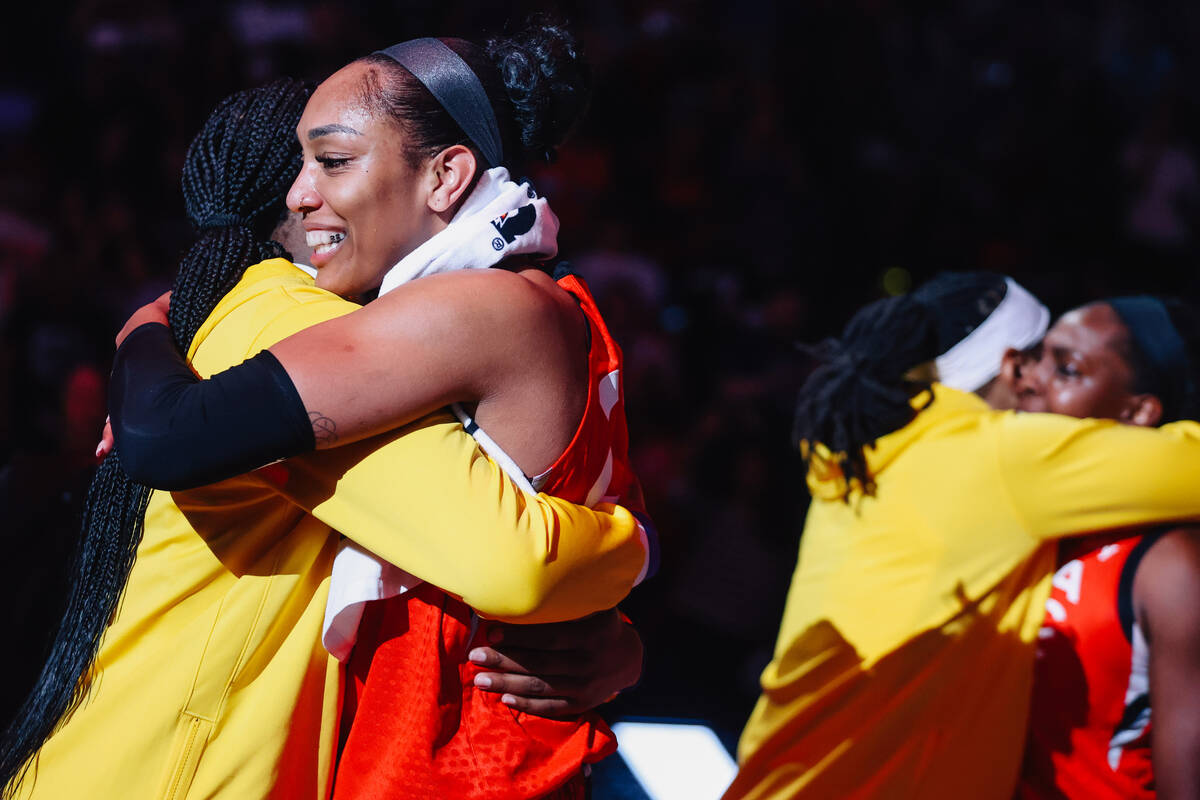 Aces center A'ja Wilson (22) greets members of the Los Angeles Sparks following a WNBA basketba ...