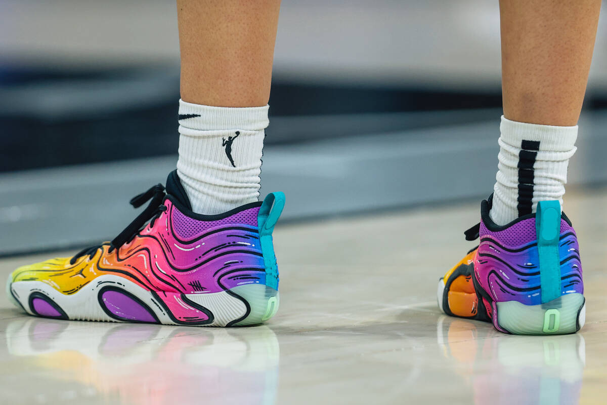 Los Angeles Sparks forward Dearica Hamby wears colorful sneakers during a WNBA basketball game ...