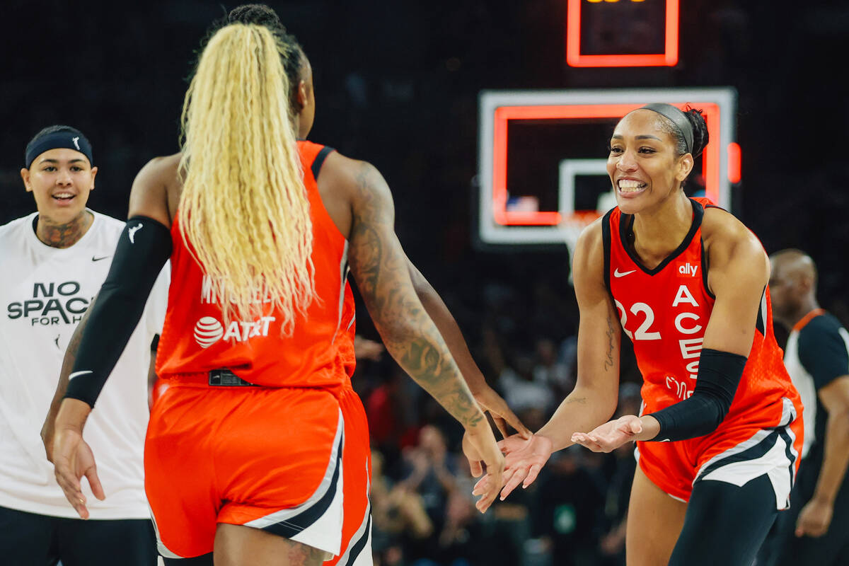 Aces center A'ja Wilson (22) celebrates with Aces guard Tiffany Mitchell (3) aduring a WNBA bas ...