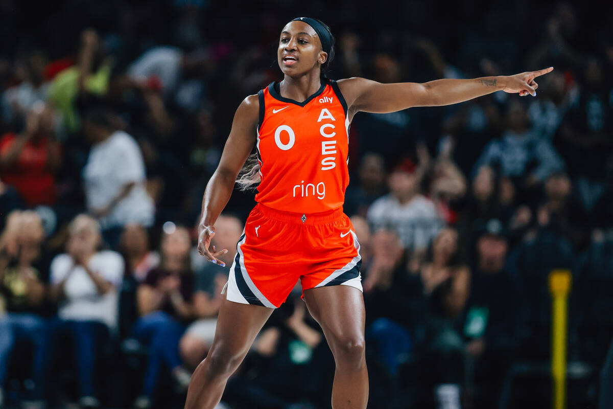 Aces guard Jackie Young (0) points during a WNBA basketball game between the Aces and Los Angel ...