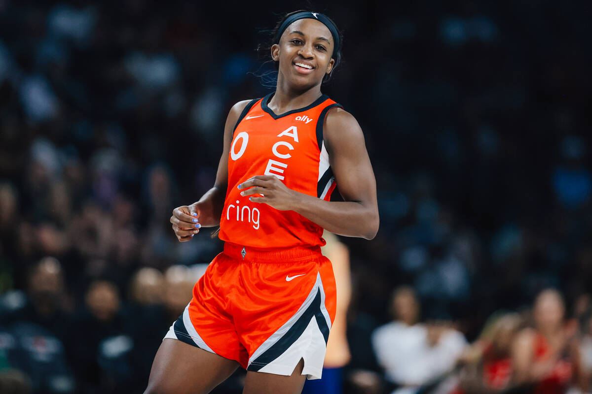 Aces guard Jackie Young smiles during a WNBA basketball game between the Aces and Los Angeles S ...