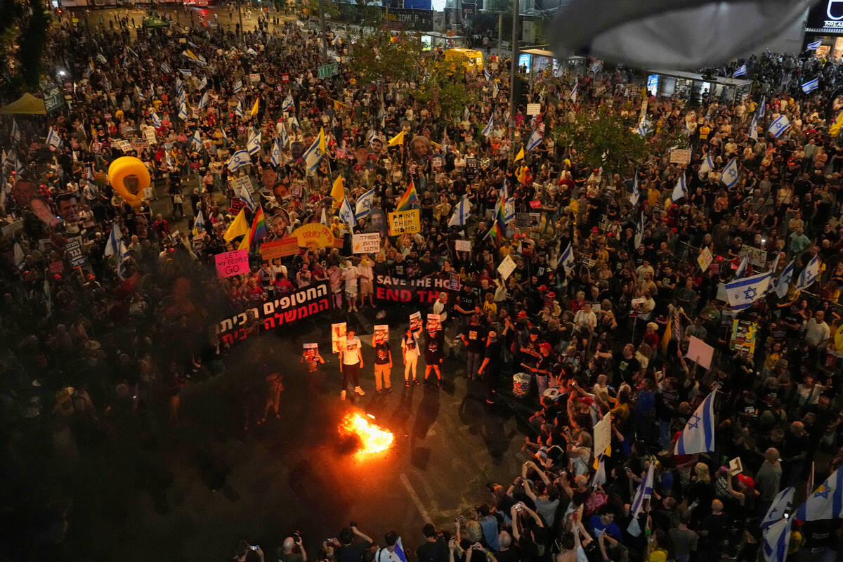 People take part in a protest demanding the end of the war and immediate release of hostages he ...