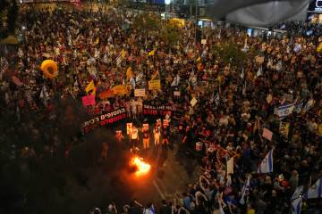 People take part in a protest demanding the end of the war and immediate release of hostages he ...