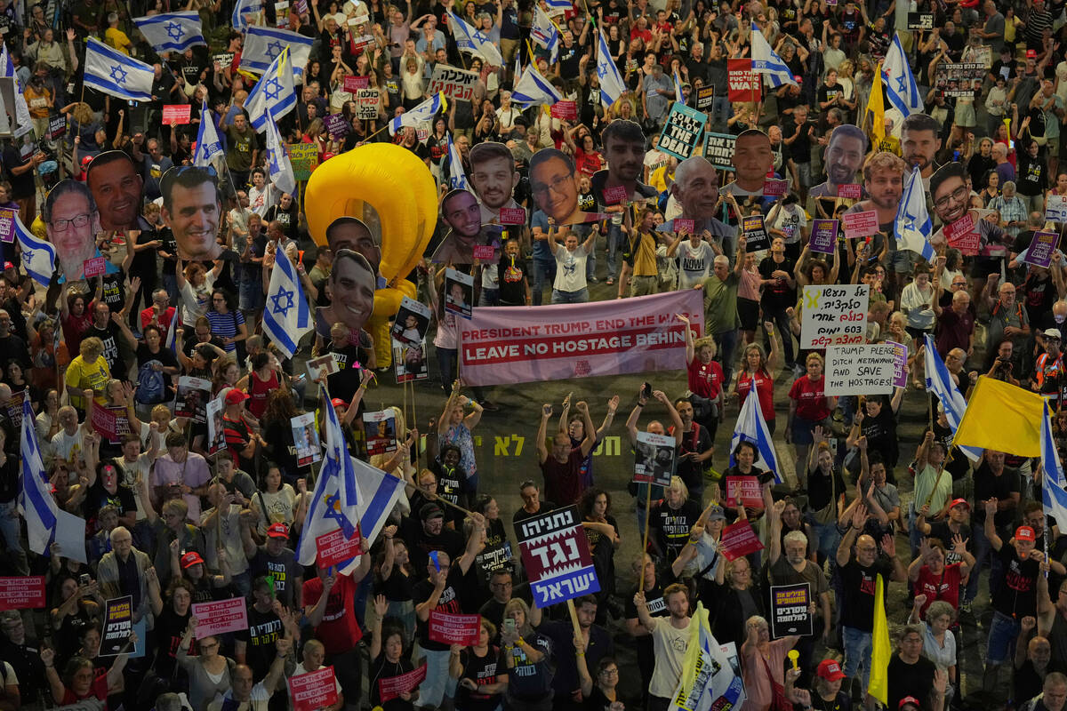 People take part in a protest demanding the end of the war and immediate release of hostages he ...