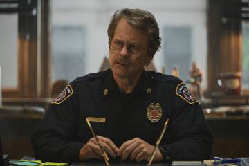 This image released by Apple TV+ shows Greg Kinnear in a scene from "Smoke." (Apple T ...