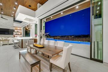 A sleek, single-story modern estate in the ultra-exclusive The Ridges community has hit the mar ...