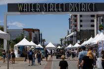 People walk along Water Street during the the Art Festival of Henderson Sunday, May 11, 2025. ( ...