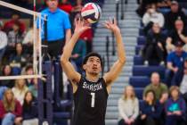 Shadow Ridge setter Kingston Jerome sets the ball during a high school boys volleyball game bet ...