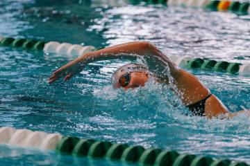 Faith Lutheran sophomore Summer Mudadu competes in the 500-yard freestyle during the swim meet ...
