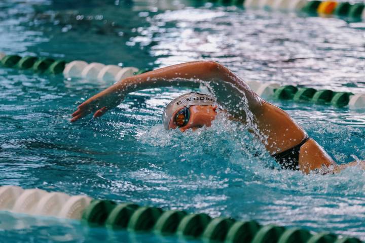 Faith Lutheran sophomore Summer Mudadu competes in the 500-yard freestyle during the swim meet ...