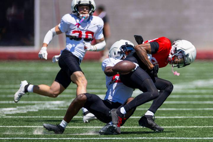 Wide receiver Jaden Bradley (85) fumbles the ball knocked out by defensive back Jaylen Allen (2 ...
