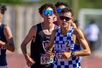 Shadow Ridge's Justin Rawe (6222) leads Faith Lutheran's Brady Anderson (5982) during the boys ...