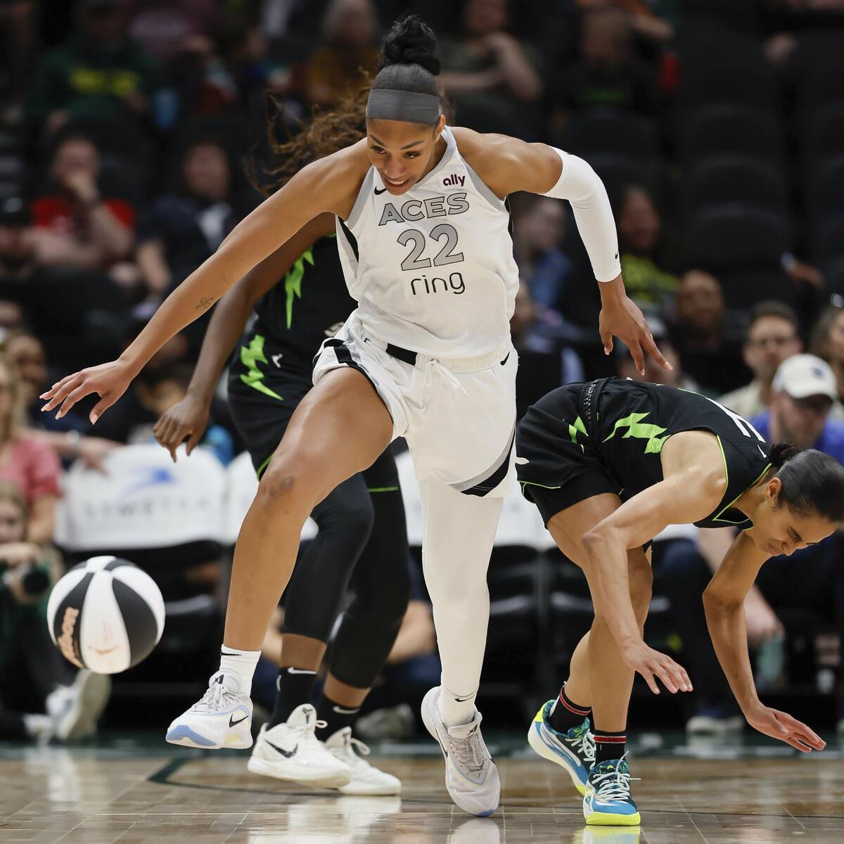 Las Vegas Aces center A'ja Wilson, left, steals the ball from Seattle Storm guard Skylar Diggin ...