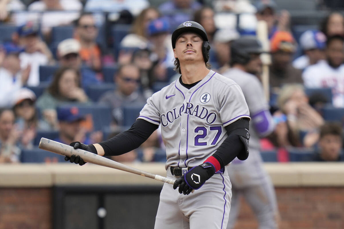 Colorado Rockies' Jordan Beck reacts after striking out swinging during the eighth inning of a ...