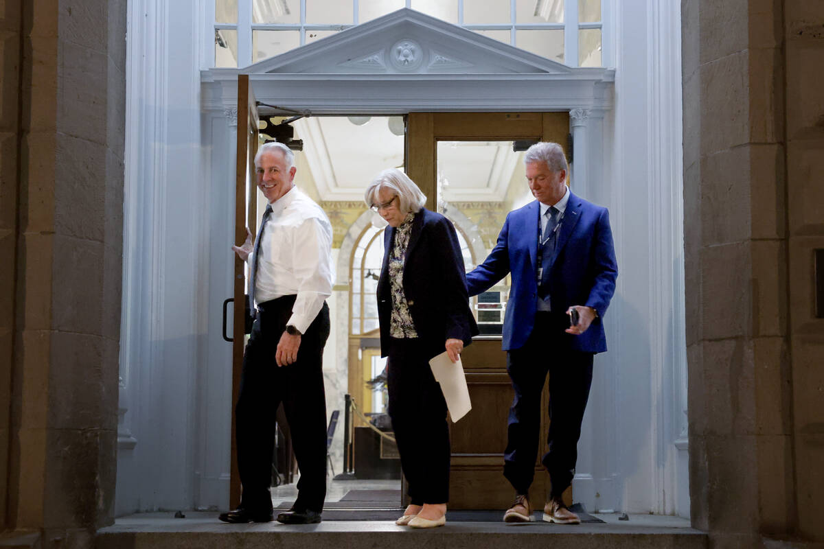 Gov. Joe Lombardo, left, and Sen. Roberta Lange, D-Las Vegas, emerge from the Capitol building ...